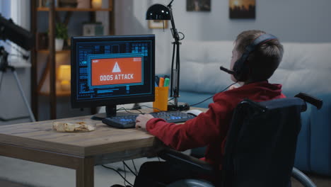 child in wheelchair playing video games and experiencing cyberattacks