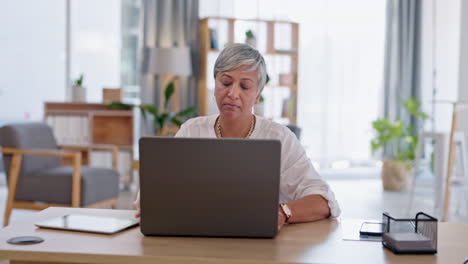 Laptop,-typing-and-senior-business-woman