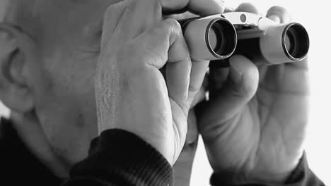 man looking through binoculars with white background with people stock video stock footage