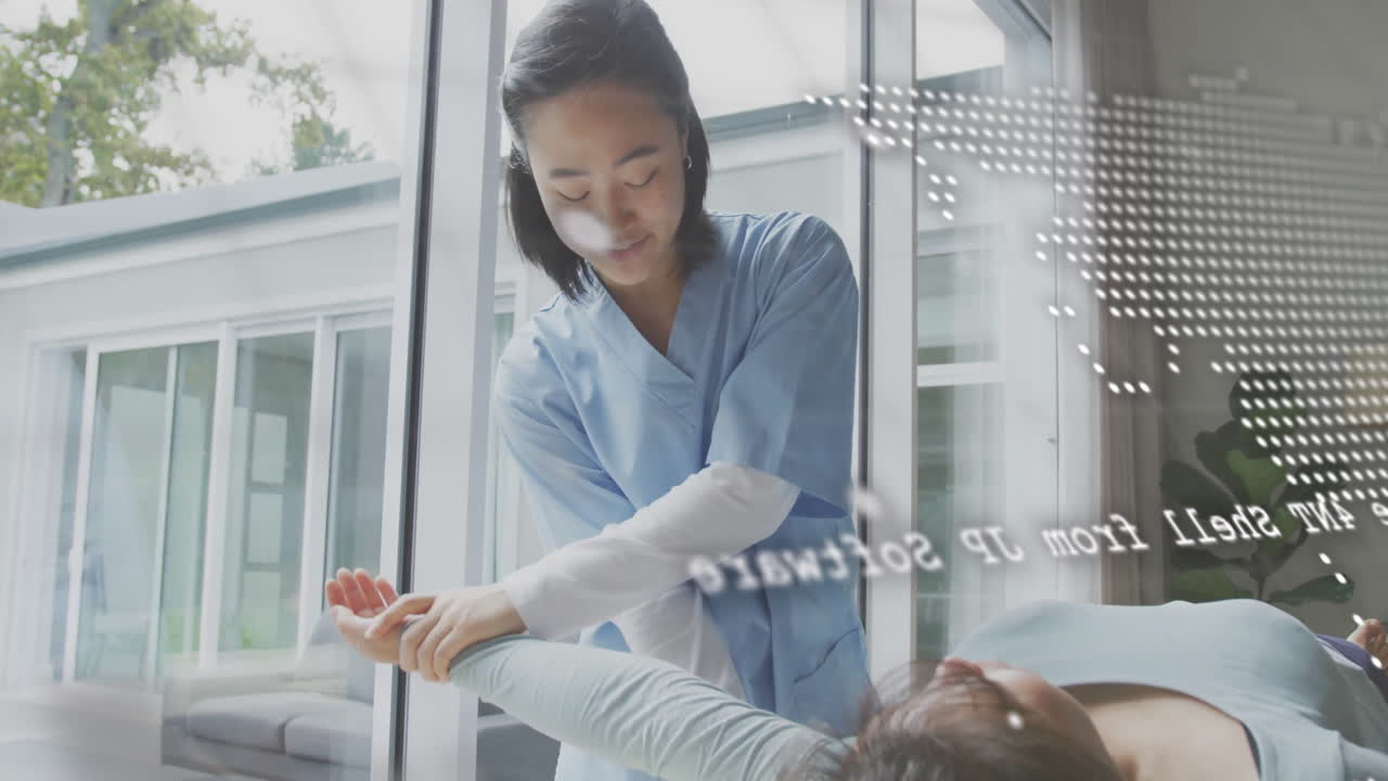 Assisting patient with arm exercise, healthcare professional in modern facility