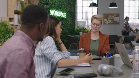 happy business people celebrating birthday party excited caucasian boss woman blowing candles enjoying surprise colleagues cheering together in multi ethnic office celebration