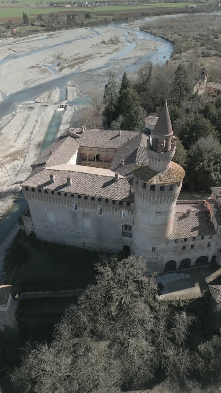 Vertical cinematic drone shots of the scenic Rivalta Castle in northern Italy.