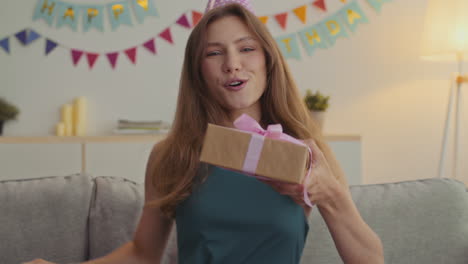 woman celebrating birthday with gift