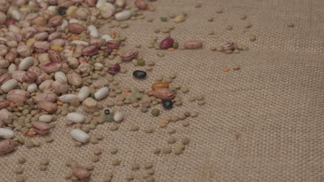 dry legumes rotating on jute background