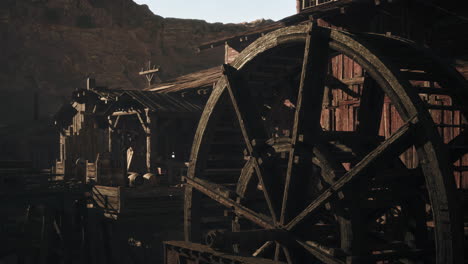 old wooden water mill in a canyon