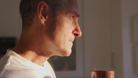 man drinking coffee at home