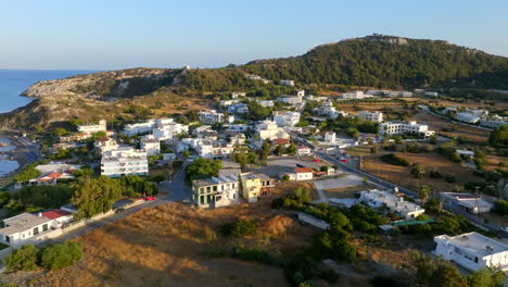 aerial view circling buildings in the faliraki town, golden hour in rhodes