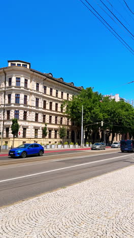 beautiful old-style architecture in the historical part of the city. buildings and road with transport in bratislava, slovakia. vertical video.