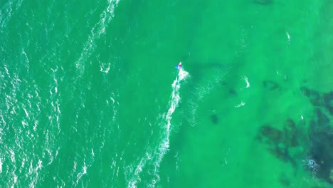 Bird&#039;s eye view of beautiful image of windsurfers crossing each other in the sea of Cascais,Portugal