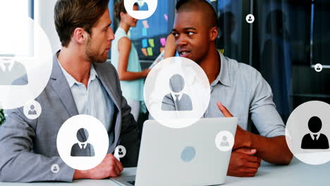 Animation of multiple profile icons over diverse entrepreneurs discussing in office
