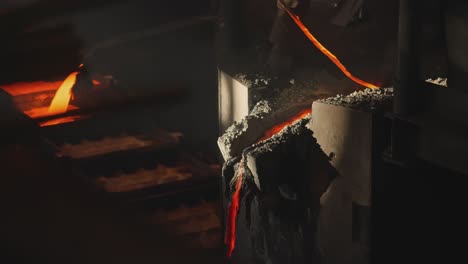 molten metal pouring into a casting mold