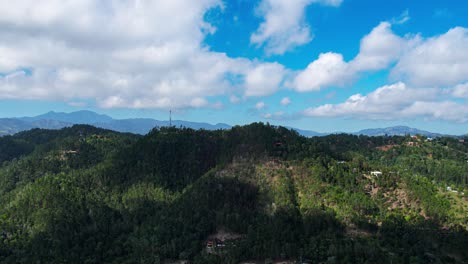 Mountains-with-clouds-in-movement-in-the-morning,-clear-day-with-a-stunning-horizon-in-a-caribbean-country,-Jarabacoa,-Dominican-Republic