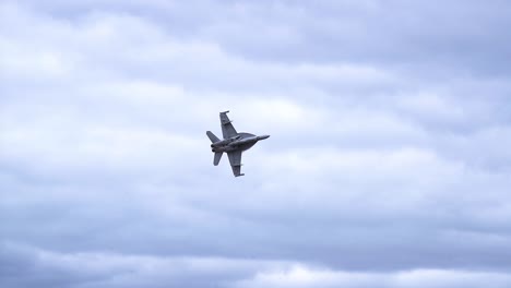 F:A-18F-Super-Hornet-In-Flight-Against-Cloudy-Sky---low-angle