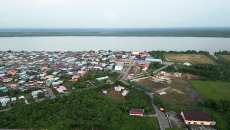 aerial drone view during summer kabong fishing village,with river and beach,sarawak,borneo