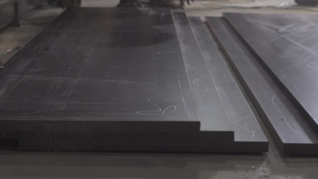 indian male carpenter working class labor inside a furniture factory