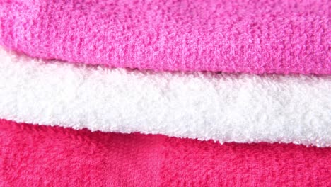 stacked pink and white towels