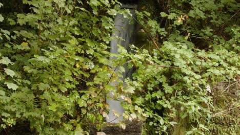 mid-shot-of-Rainwater-being-funnelled,-controlled-under-the-platform-at-Cynonville-Station