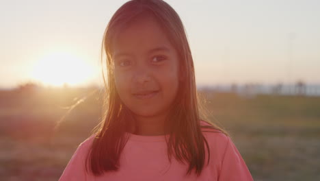 close up portrait beautiful little girl smiling happy enjoying carefree summer day on park sunset background peaceful childhood