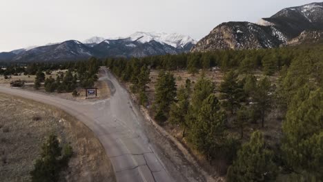 drone rising over lonely road to show mount antero in the rocky mountains in colorado