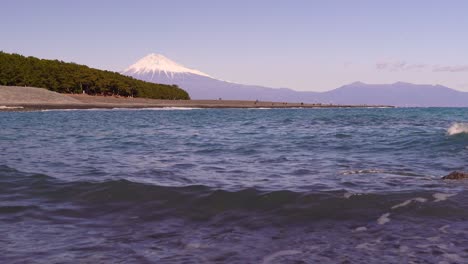 low angle view of mount fuji with ocean and beach at famous miho no matsubara