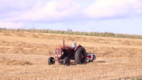 tractor on open field, summer.