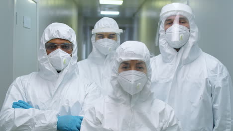 Group-of-Doctors-in-Protective-Uniforms-Posing-for-Camera