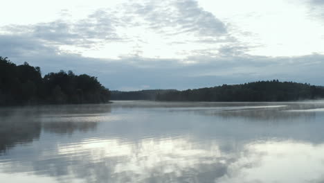 4k-Drone-flying-close-to-the-water-surface-on-a-large-lake