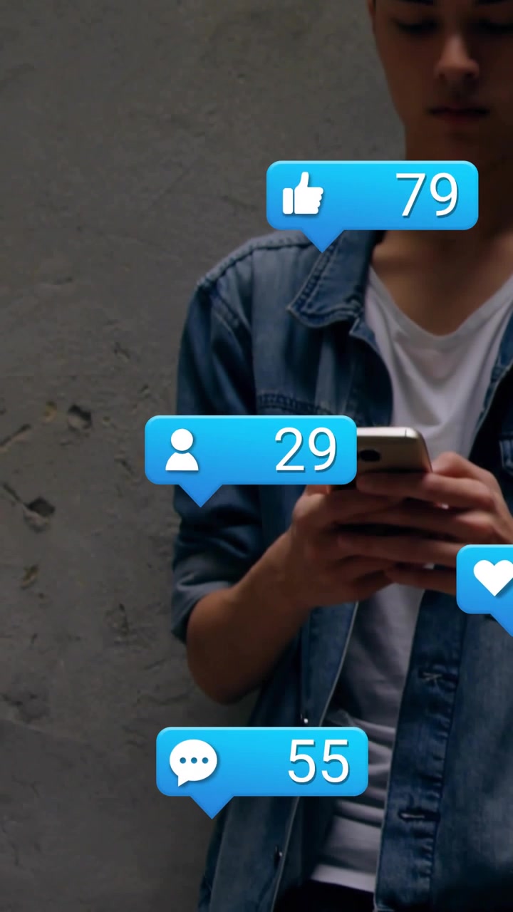 Vertical video: Man tapping phone, leaning, bubbles rising, likes and users rising, gaining reach