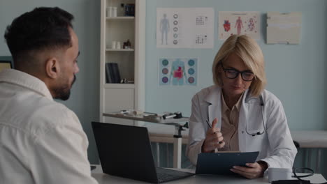 doctor consulting with patient in office