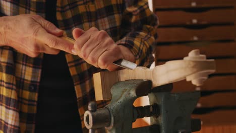 female luthier at work in her workshop