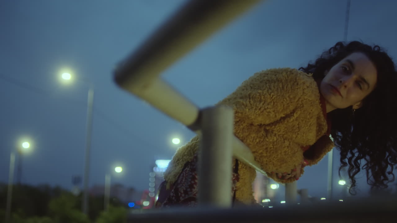 Woman Looking at Night City