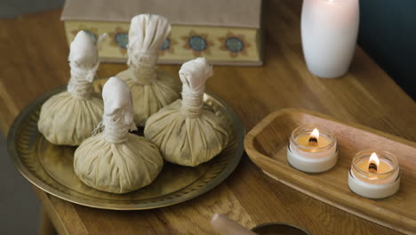 spa relaxation with herbal compress and candles