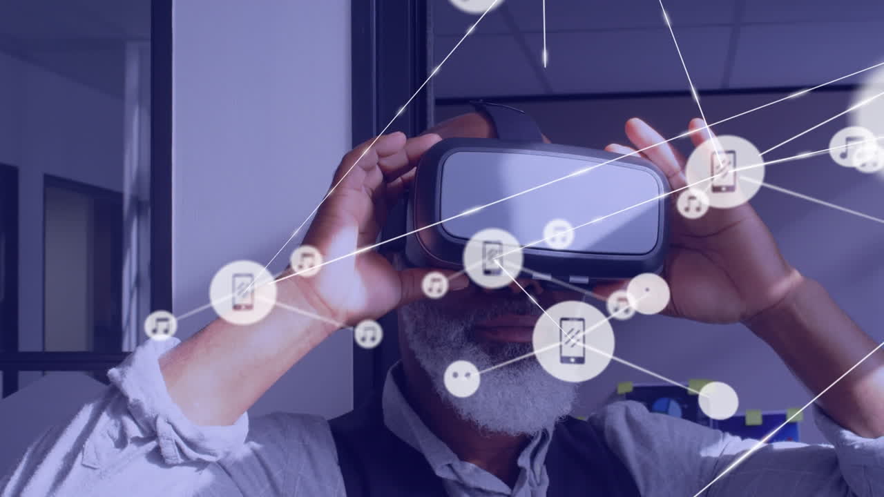Animation of network of connections with icons over african american businessman using vr headset