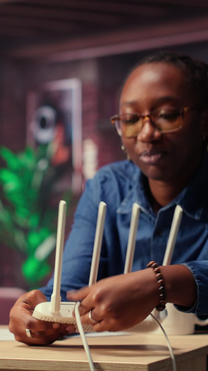 African American Woman Explaining Wi-Fi Router Connection