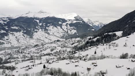 Drone-Aerial-view-of-the-snowy-Grindelwald-and-the-Eiger-in-the-beautiful-swiss-mountain-landscape