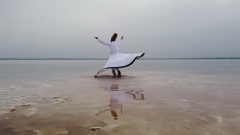 sunset and whirling at the sea, sufi. sufi whirling (turkish: semazen)