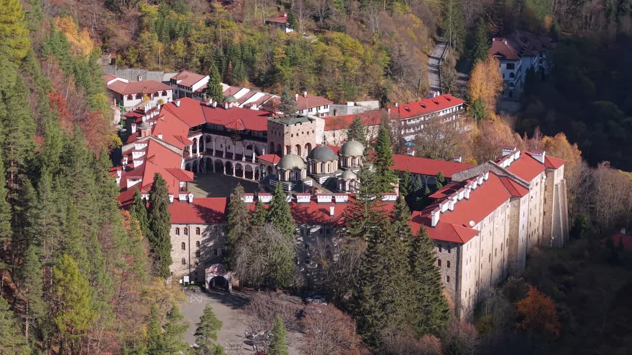 A drone approaches Rila Monastery, gradually revealing the central chapel and showcasing the monastery’s architecture and details from above