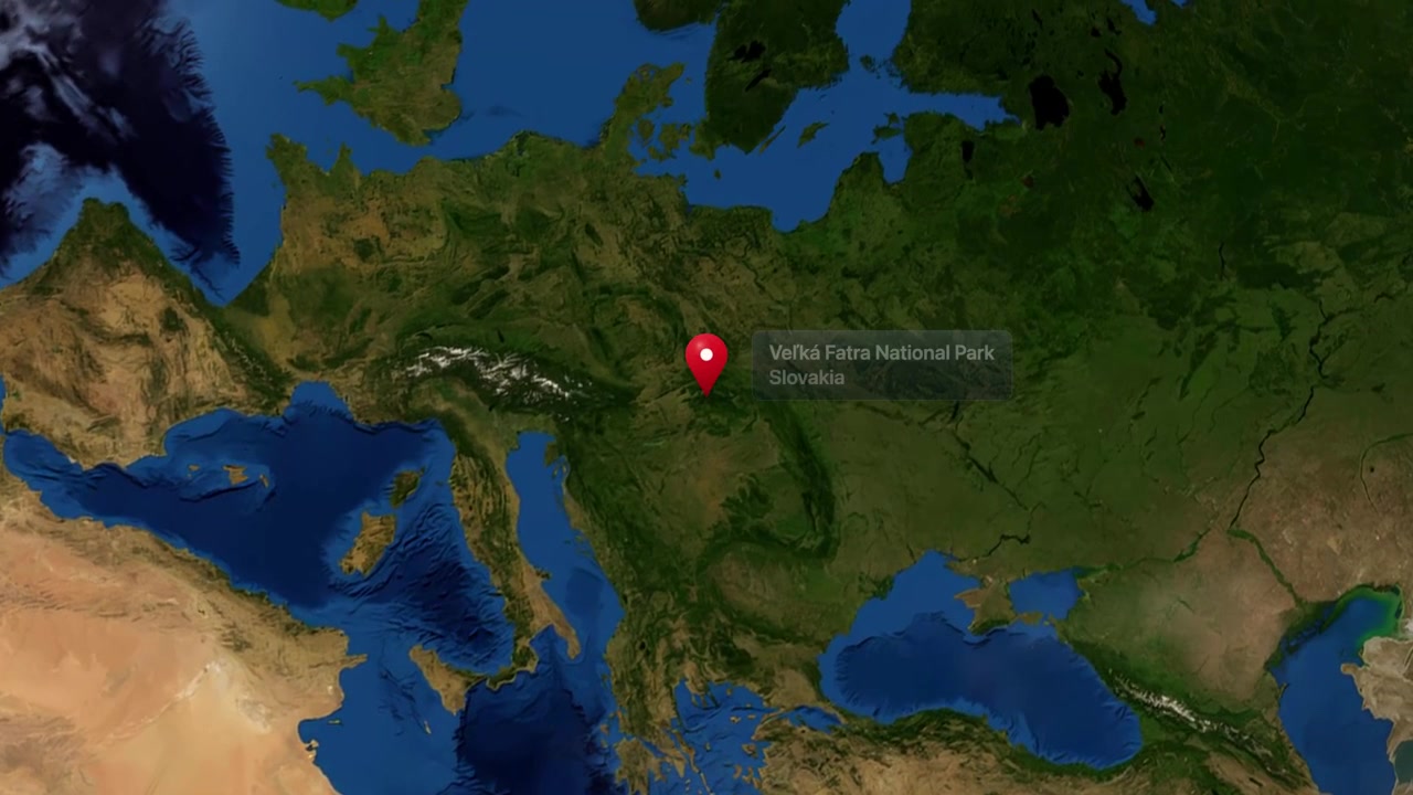 Satellite view zooms from outer space to Velka Fatra National Park in Slovakia with marker. Includes NASA public domain imagery.