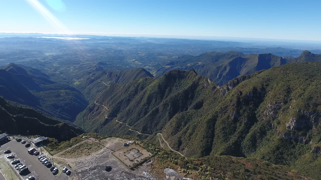 Serra do Rio do Rastro, Santa Catarina. Full scene of landscape showing the belvedere, cars and the road. Aerial scene in high altitude.