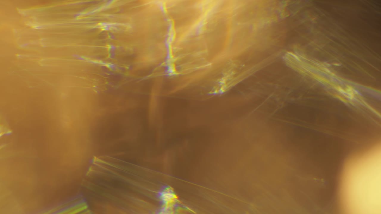 Multicolored light leaks 4k footage on black background. Stylizing video, transitions. Bokeh effect