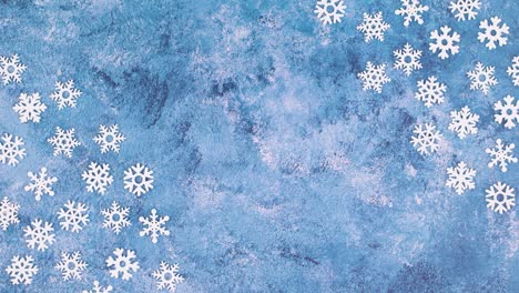 snowflakes move on corner of blue icy theme. stop motion