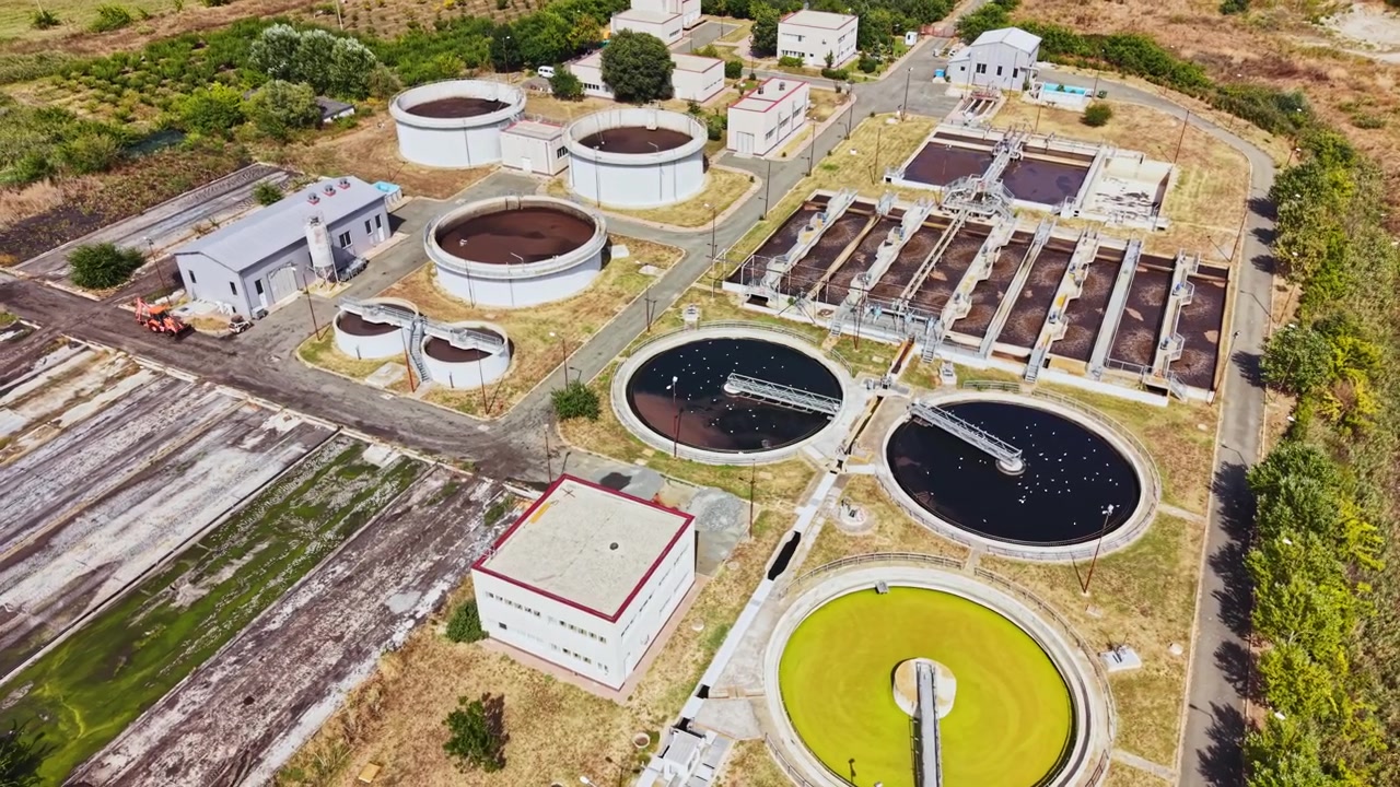 Wastewater treatment facility in a rural area operating with multiple tanks and buildings for processing