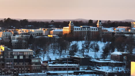 golden hour over washington county courthouse with snowy fayetteville backdrop, tranquil dusk setting