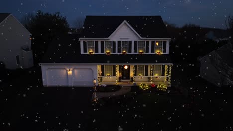 snow flurries falling on american home decorated with christmas lights at night during december snowfall