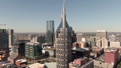 circling aerial view of downtown nashville, tennessee on a clear, fall day