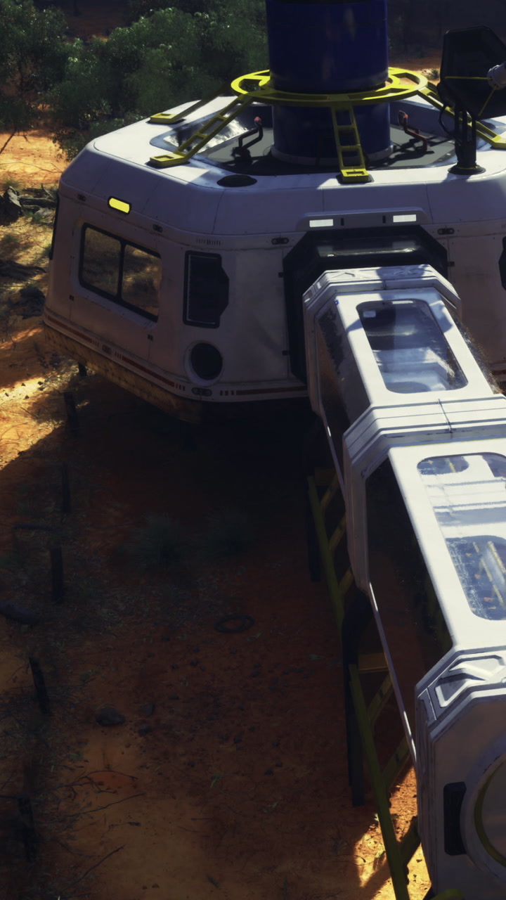Transport vehicle parked on dry ground near a rocky area in daylight