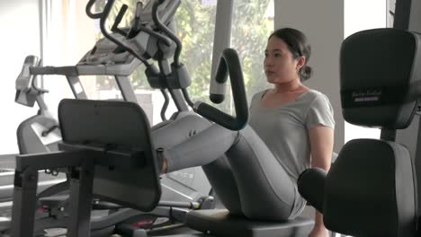 asian woman fitness asian woman working out on various fitness equipment fitness equipment