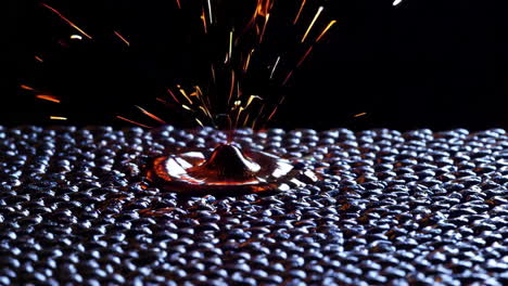 dynamic sparks on textured surface with molten spot