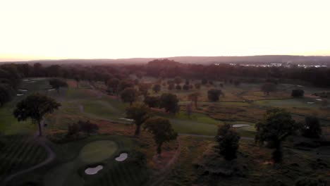 aerial view of golf course at sunset