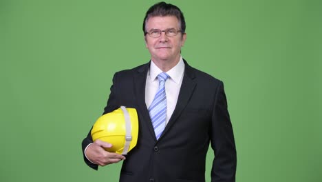 senior handsome businessman as engineer